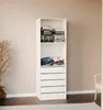 A white storage unit with shelves and drawers, filled with folded clothes, stands against a light beige wall. Anteprima dell’immagine prodotto