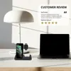 A desk setup with a laptop, a lamp, and a wireless charging station for Apple devices. Produktbild-Vorschau