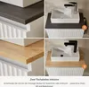 A collage showing two different countertop options for a white sink and vanity. Produktbild-Vorschau