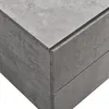 A close-up view of the corner of a modern nightstand with a concrete-like finish. Anteprima dell’immagine prodotto