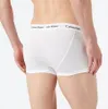 A person wearing white Calvin Klein boxer briefs, shown from the back. Produktbild-Vorschau