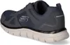 A side view of a navy blue Skechers athletic shoe. Voir les images du produit
