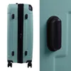 A split image showing the front of a teal suitcase on the left and a close-up of a textured teal surface with a black handle on the right. Náhľad obrázku produktu