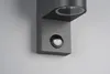 A close-up shot of a modern, dark gray outdoor wall light with a motion sensor. Produktbild-Vorschau