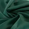 A close-up, abstract view of folded green fabric. Náhled obrázku produktu