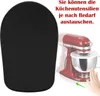 A black mat for a kitchen appliance is shown next to a red stand mixer. Text is overlaid on the image. Produktbild-Vorschau