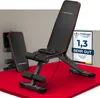 A black and red adjustable weight bench is displayed on a red platform against a light gray background. A second, folded weight bench is visible in the background. Produktbild-Vorschau