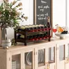 A wine rack filled with wine bottles sits on a wooden cabinet, with a floral arrangement and a chalkboard menu in the background. Podgląd zdjęcia produktu