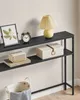 A dark console table with decorative items on it. Náhled obrázku produktu