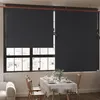 A dining table set up in front of a large window with roller blinds. Voir les images du produit
