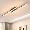 A modern LED ceiling light fixture with two black bars and integrated LED lights, mounted on a white ceiling. Produktbild-Vorschau