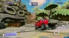 A racing video game scene with a red truck on a dirt track, with a large stone head structure in the background. Produktbild-Vorschau