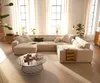 A spacious living room with a large sectional sofa, coffee table, and large windows with sheer curtains. Produktbild-Vorschau