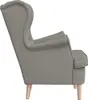 A side view of a taupe fabric armchair with wooden legs. Náhľad obrázku produktu