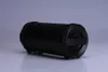 A black cylindrical speaker is shown on a reflective surface against a light gray background. Anteprima dell’immagine prodotto