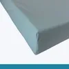 A close-up view of a light blue mattress corner. Produktbild-Vorschau