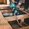 A person is using a cordless chainsaw to cut through wooden beams in a construction or renovation setting. Produktbild-Vorschau
