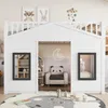 A child's loft bed designed to look like a house, with windows and a doorway, set up in a room with decorative elements. Produktbild-Vorschau