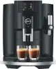 A black Jura E8 coffee machine with two glasses of espresso in front of it. Podgląd zdjęcia produktu