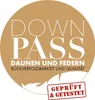 A circular logo with text and a feather graphic. Produktbild-Vorschau