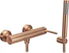 A copper-colored shower faucet and handheld showerhead are displayed against a white background. Produktbild-Vorschau
