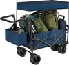 A blue folding wagon filled with camping gear, including backpacks and sleeping bags, on a white background. Voir les images du produit