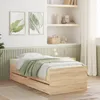 A bedroom scene with a bed and wall decorations. Voir les images du produit