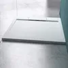 A white shower tray is shown on a light gray tiled floor, with a teal wall in the background. Produktbild-Vorschau