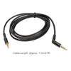 A black audio cable with gold connectors is coiled on a white background. Náhled obrázku produktu