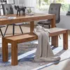 A wooden dining bench with a knitted throw is placed in front of a wooden dining table, with chairs and a window in the background. Anteprima dell’immagine prodotto