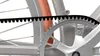 Close-up view of a bicycle's belt drive system, showing the belt, chainring, and part of the wheel and frame. Anteprima dell’immagine prodotto