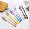 A collection of cutlery laid out on a white surface with some text and a wooden cutting board. Produktbild-Vorschau