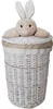 A white wicker laundry basket with a lid and a plush bunny toy on top. Produktbild-Vorschau
