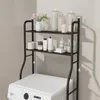 A black metal shelf unit for a washing machine, holding various bathroom or laundry products. Produktbild-Vorschau