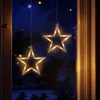 Two star-shaped LED lights hanging in a window at night. Anteprima dell’immagine prodotto