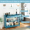 A blue console table with drawers and shelves, decorated with various items. Náhľad obrázku produktu