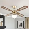 A ceiling fan with wooden blades and a light fixture is shown against a white ceiling. Náhľad obrázku produktu