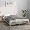 A bed with gray bedding in a room with two framed pictures on the wall and a plant. Náhľad obrázku produktu