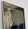 A close-up view of a decorative mirror with a beveled edge and a diamond pattern. Produktbild-Vorschau