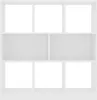A white, empty bookshelf with multiple compartments against a white background. Náhled obrázku produktu
