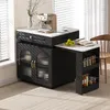 A modern kitchen island with a coffee maker, fruit, and books, set against a window with blinds. Podgląd zdjęcia produktu