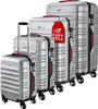A set of four silver suitcases of varying sizes, arranged diagonally. Produktbild-Vorschau