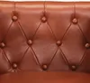 A close-up view of the tufted leather upholstery of a chair. Produktbild-Vorschau