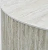 Close-up view of a round table with a textured beige surface and fluted sides. Náhled obrázku produktu