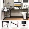 A black L-shaped desk with a computer, lamp, and other office supplies. Náhled obrázku produktu