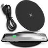A black wireless charger with a USB cable and a smartphone being charged. Produktbild-Vorschau