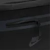 A close-up of a black Nike hip pack, showing a zippered pocket and the Nike logo. Náhľad obrázku produktu