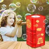 Rote Bubble-Maschine mit goldenen chinesischen Schriftzeichen, die um ein lächelndes Kind im Freien Blasen erzeugt Náhled obrázku produktu