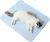 A cat is sleeping on a light blue cooling mat. Náhľad obrázku produktu
