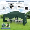 A green pop-up gazebo set up on a grassy lawn with tables and chairs inside, showcasing its features with text overlays. Voir les images du produit